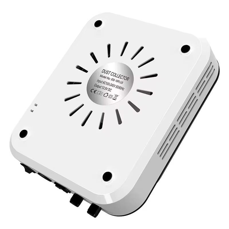 Aspirator cu Freza Manichiura 2 in 1 Blueque 858-18Plus | Set Capete Inclus vazut din unghi inferior, prezentand fantele circulare de ventilatie de pe spatele carcasei albe si piciorusele anti-alunecare.